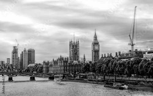 Grayscale of the London skyline with Buckingham Palace Big Ben and a waterscape