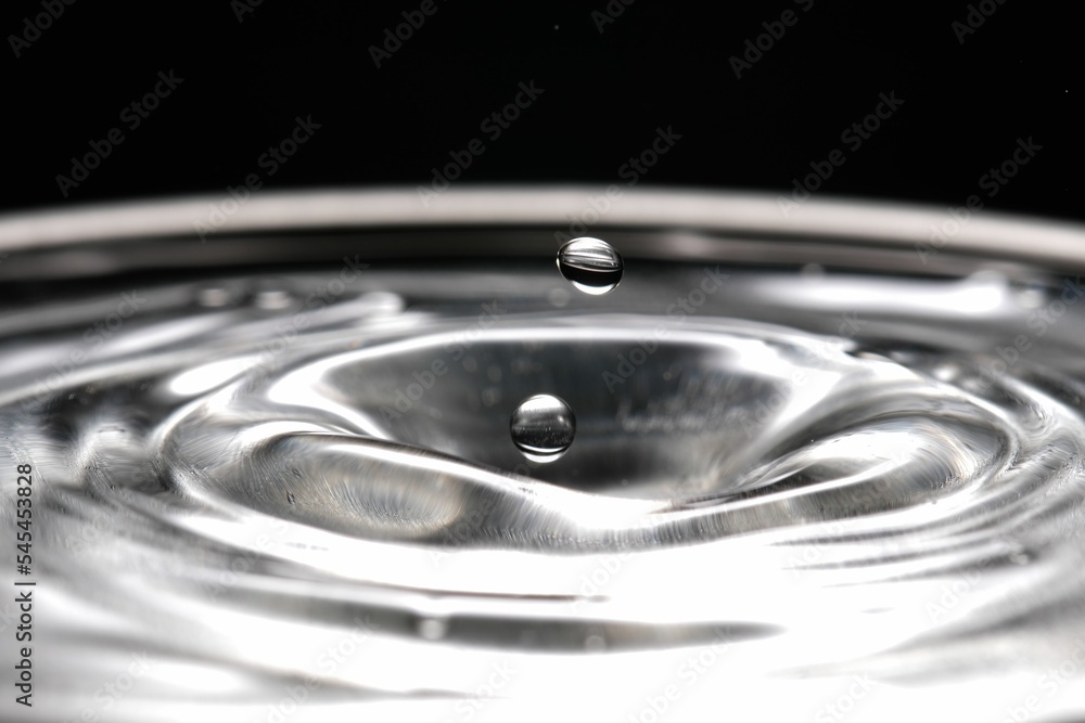 Macro shot of splashing water drop, grayscale shot Macro shot of splashing water drop, grayscale shot