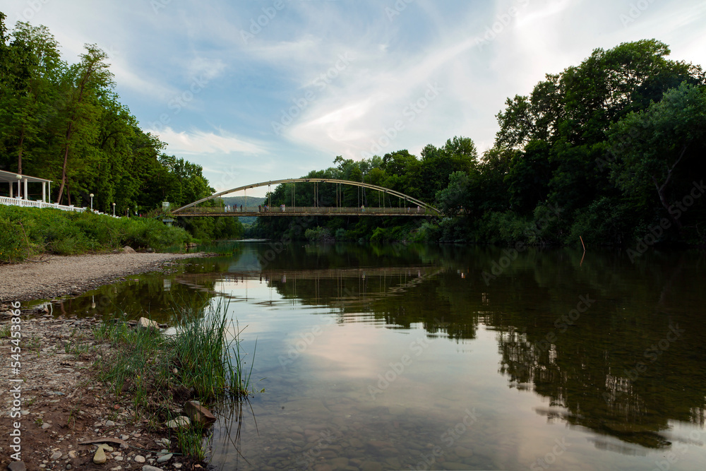 Landscape on the riverbank with a reflection of the sky