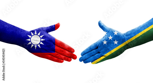 Handshake between Taiwan and Solomon Islands flags painted on hands, isolated transparent image.
