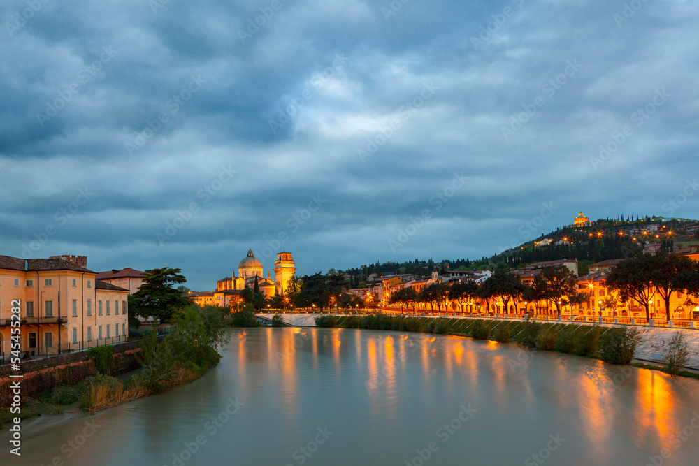 Fototapeta premium Adige river in Verona, Sunrise cityscape of Verona. Architecture and sights of Verona. Italy.