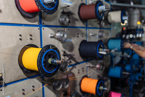 Obraz na płótnie production of glass fiber fiber optic cable in the factory, Internet telecommunications wires in coils. w salonie