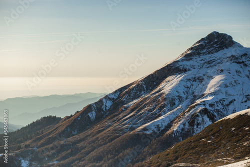 Aibga Mountain Range covered with snow in sunlight