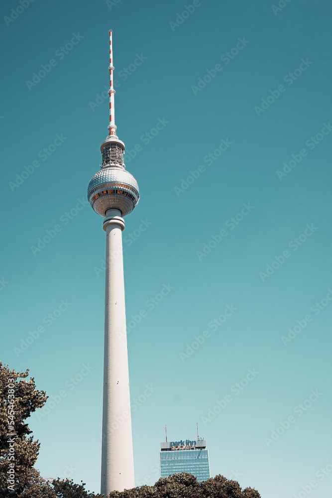 Fototapeta premium Vertical low angle of the Berlin television tower against a blue sky