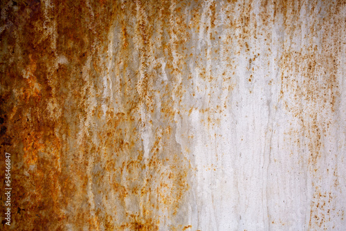 Texture of rusty iron, cracked paint on an old metal surface. Sheet of rusty metal with cracked and peeling paint, background for design with copy space. © Vera