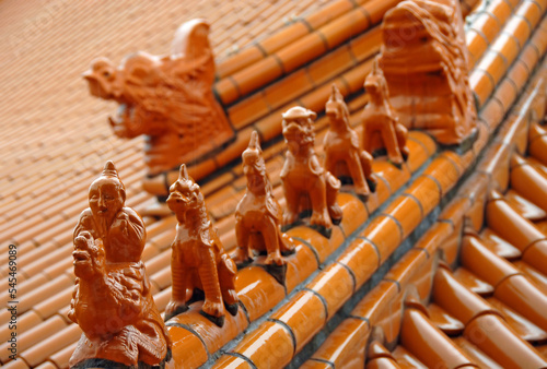 Decorative finials in the form of mythical beasts on a roof at the Fo Guang Shan Nan Tien Temple, a Buddhist temple at Berkeley near Wollongong, Australia. photo