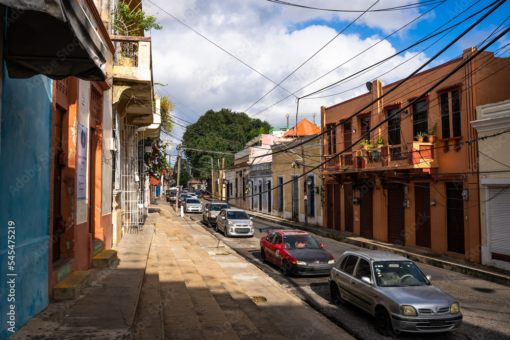 Dominican Republic, Santo Domingo - November 6, 2022: Beautiful street in a colonial city at sunset. The historical district of the capital. Popular tourist routes