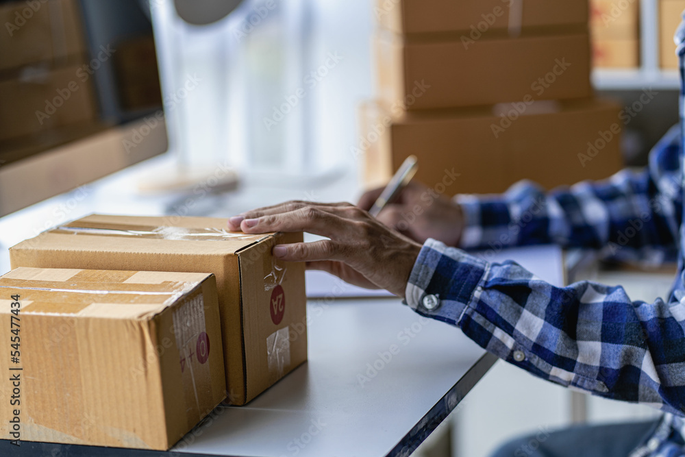 SME Business Entrepreneur Working From Home With Parcel Boxes And Laptop Taking Orders And Shipping Online Grocery Business Ideas