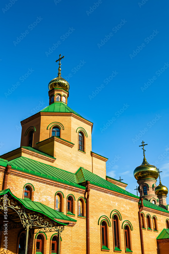 Obraz premium Christian church cross in high steeple tower for prayer
