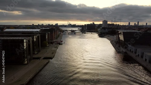 Drone shot over a canal in Copenhagen at sunset