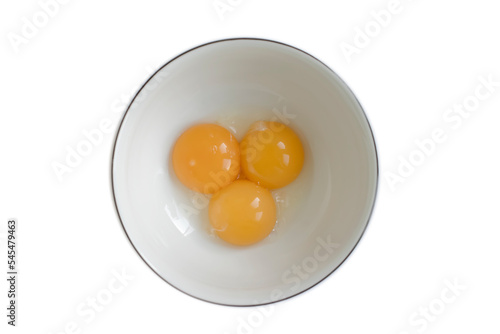 Raw eggs in a plate isolated on white background