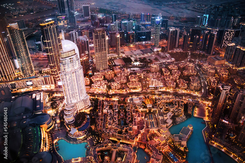 Photography Dubai city at night, view with lit up skyscrapers and roads
