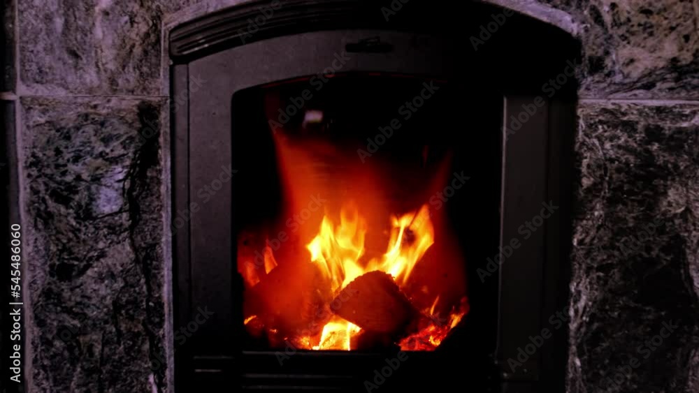 firewood burns in stove, female hands throw euro banknotes, burning stone and enjoying warmth, concept of cozy winter, saving heat, beginning of heating season, energy problem of population firewood burns in stove, female hands throw euro banknotes, burning stone and enjoying warmth, concept of cozy winter, saving heat, beginning of heating season, energy problem of population