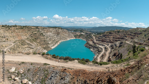 Turquoise quarry lake in the shape of a heart. Kadykovsky quarry, Balaklava, Crimea. Travel, attractions