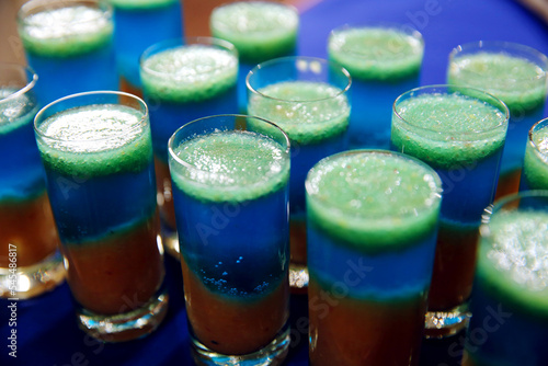 Several shots at the bar in a nightclub. Side view