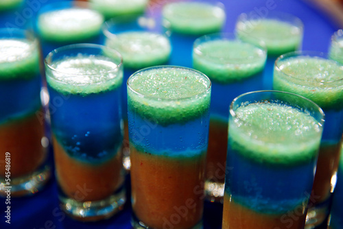 Several shots at the bar in a nightclub. Side view