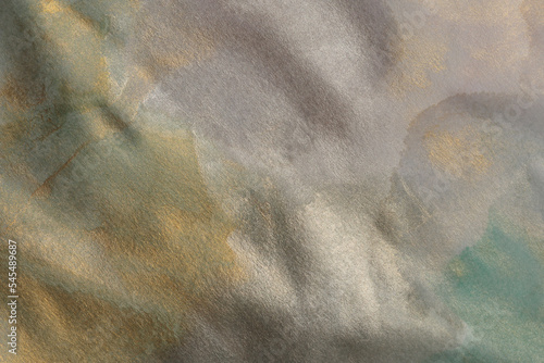 Soft wet watercolor paper texture painting wall.  Abstract gold and nacre copy space background. photo