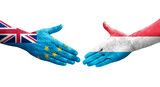 Handshake between Tuvalu and Luxembourg flags painted on hands, isolated transparent image.