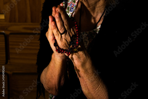 Grandmother praying to god (ID: 545492631)