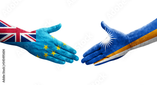 Handshake between Tuvalu and Marshall Islands flags painted on hands, isolated transparent image.