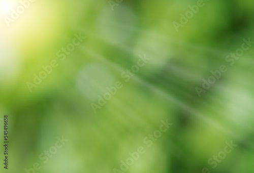 Defocused or blurred photo of sun  rays or light beam with boked and nature background.