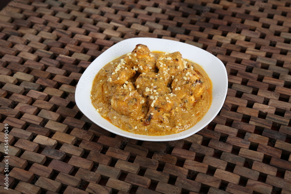 Chicken Malai Korma masala karahi served in a dish isolated on table side view of middle east food