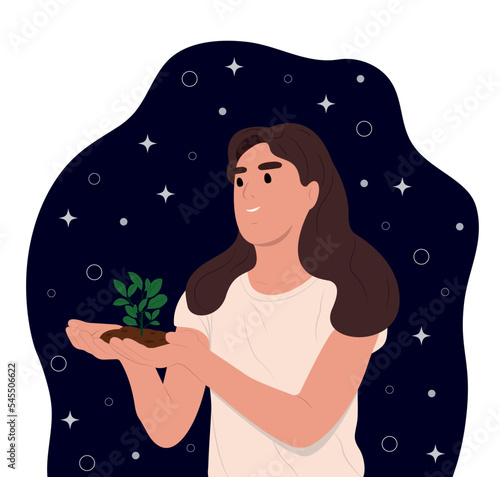 World Soil Day is held annually on December 5. The girl is holding a green plant in her hands. Forest restoration, reforestation planting trees, environment day.