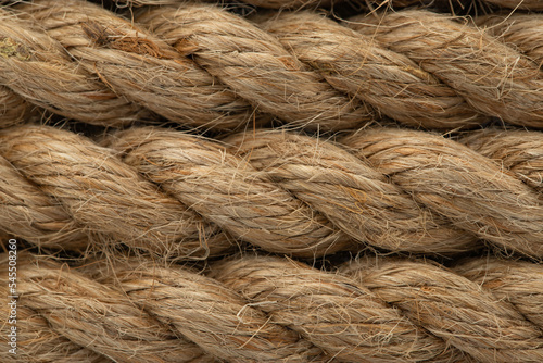 thick hemp rope made of jute, rolled into a roll, natural texture