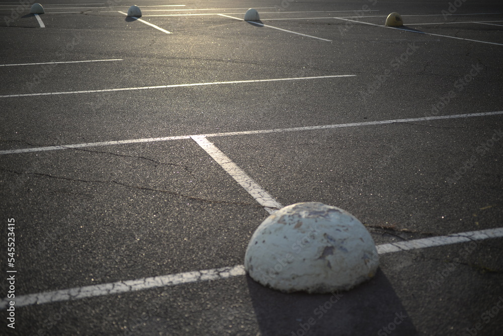 concrete traffic limiters concrete markers painted white, parking space