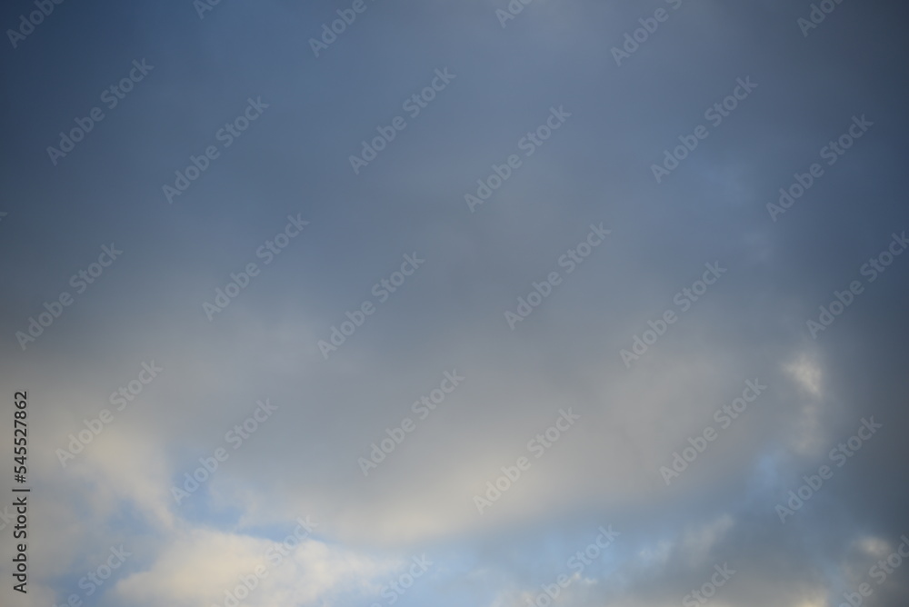 Fototapeta premium cloudy blue sky white cirrus clouds in Ukraine beautiful solar steam water solar energy, wind, sky and clouds, watercolor texture cloudy sky illuminated by the rays of the sun, stratosphere, atmospher