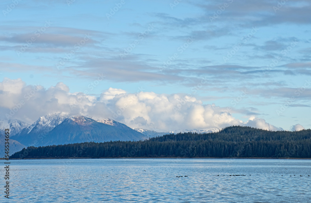 Snow dusted mountains by the sea in Southeast Alaska