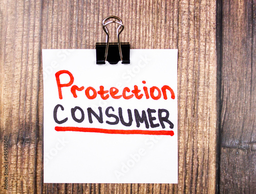 Protection consumer - text concept on a piece of paper on the table. The concept of consumer rights protection.