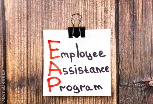 EAP. Employee assistance program - text concept on a piece of paper on the table.