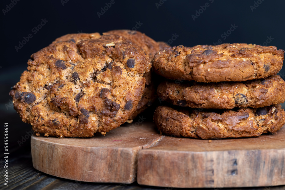 Fototapeta premium Delicious cookies with pieces of chocolate on the table