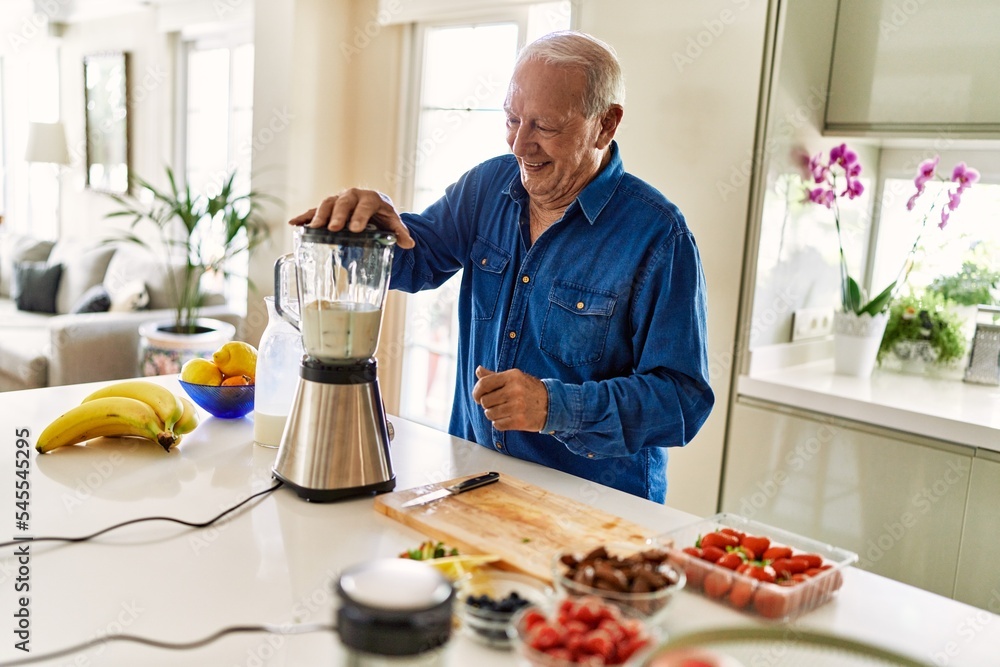 Senior man smiling confident shaking blender at kitchen Senior man smiling confident shaking blender at kitchen