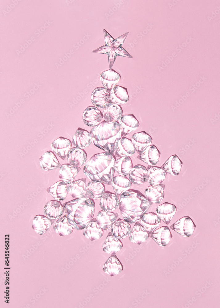 Christmas tree made of diamonds on pastel light pink background. Minimalistic New Year concept. Christmas flat lay. Creative Xmas composition. Christmas tree made of diamonds on pastel light pink background. Minimalistic New Year concept. Christmas flat lay. Creative Xmas composition.