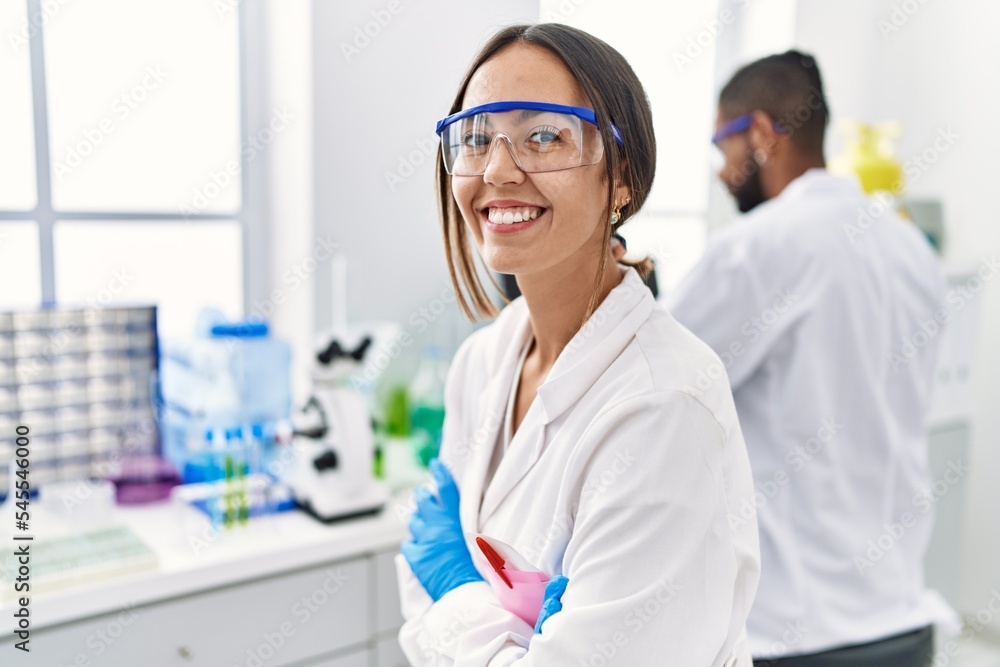 Man and woman scientist partners smiling confident working at laboratory Man and woman scientist partners smiling confident working at laboratory