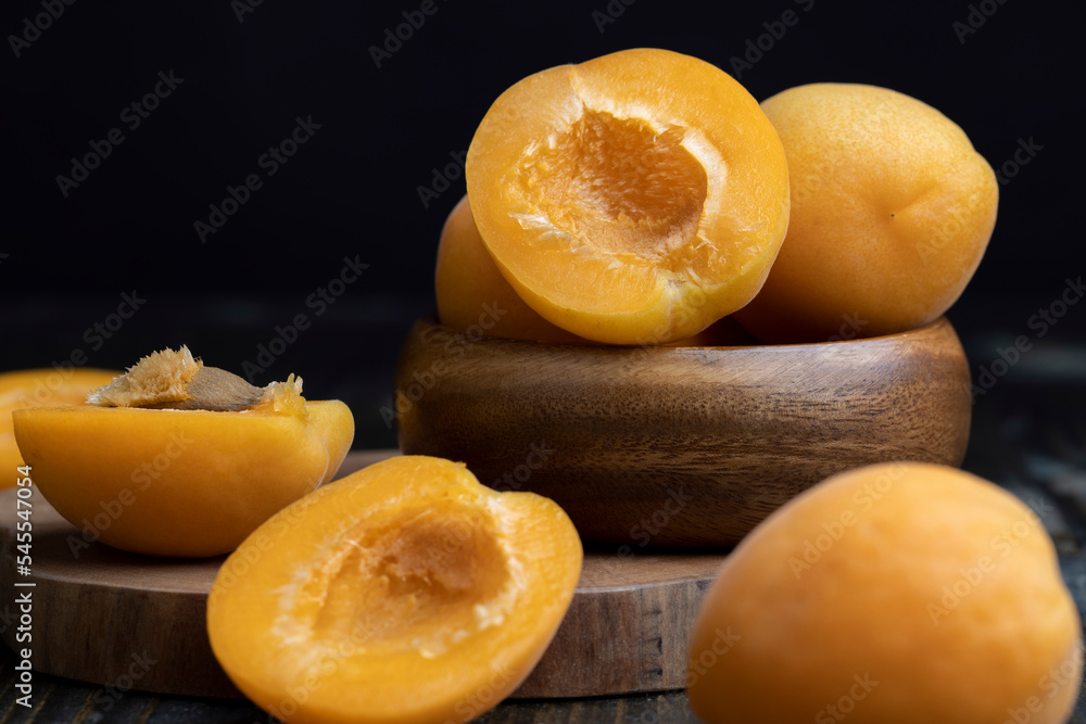 Orange-colored ripe apricot cut into pieces