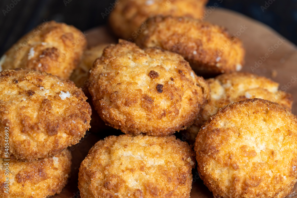 Delicious cookies with coconut on the table