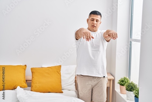Fotografia Young latin man somnambulist sleepwalking at bedroom