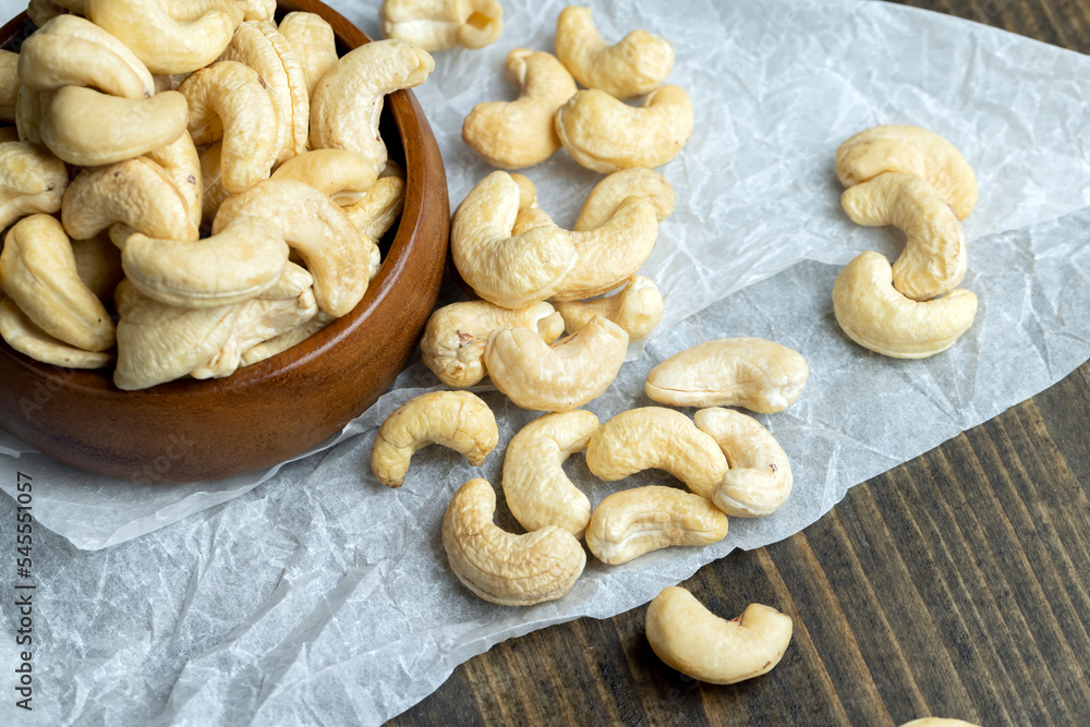 Fototapeta premium Fresh peeled cashew nuts on the table