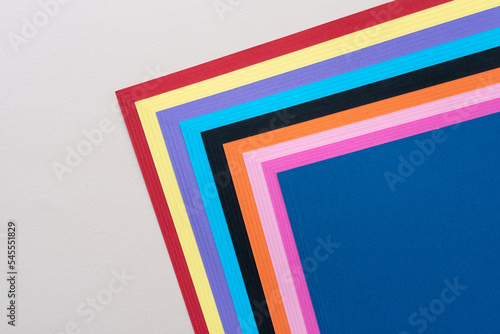 corner of a stack of colorful card stock sheets