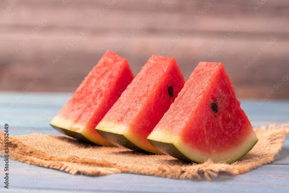 watermelon slices on the wooden table