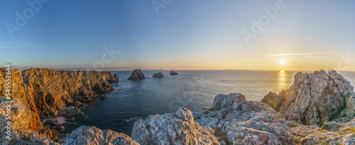 Panorama of the coastline at Pointe de Pen-Hir with golden sunlight during sunset, Camaret-sur-Mer, Parc naturel regional Armorique, Brittany, France