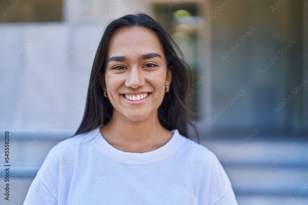 Young beautiful hispanic woman smiling confident standing at street Young beautiful hispanic woman smiling confident standing at street
