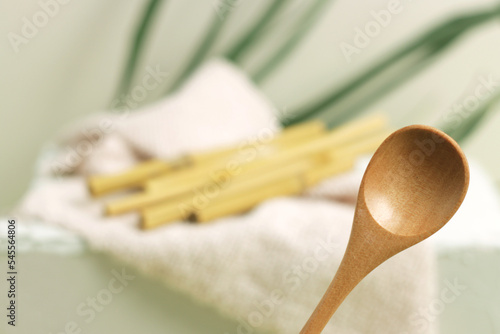 Eco bamboo spoon on green background. Concept, natural material organic cutlery, zero waste, eco-friendly (ID: 545564806)