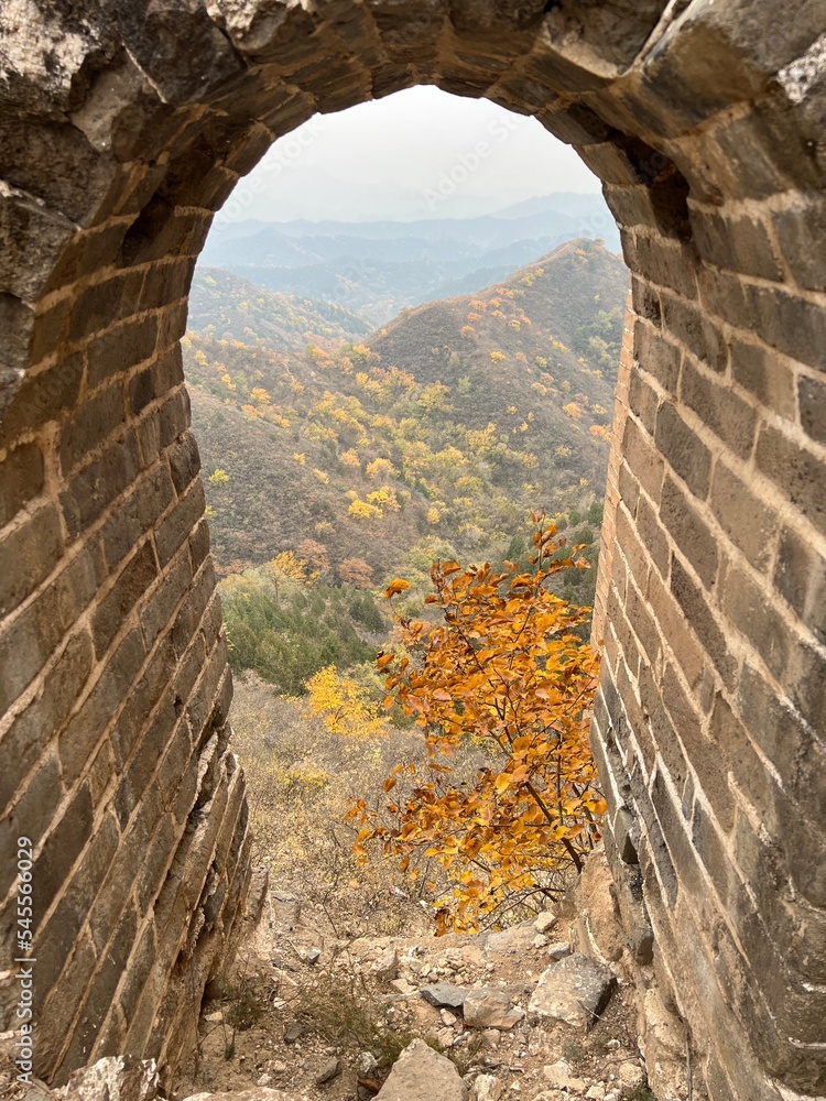 ruins of the ancient fortress - Great Wall China, window with autumn scenery of nature