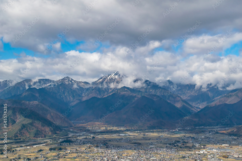 Landscape with cloud and snow covered mountains