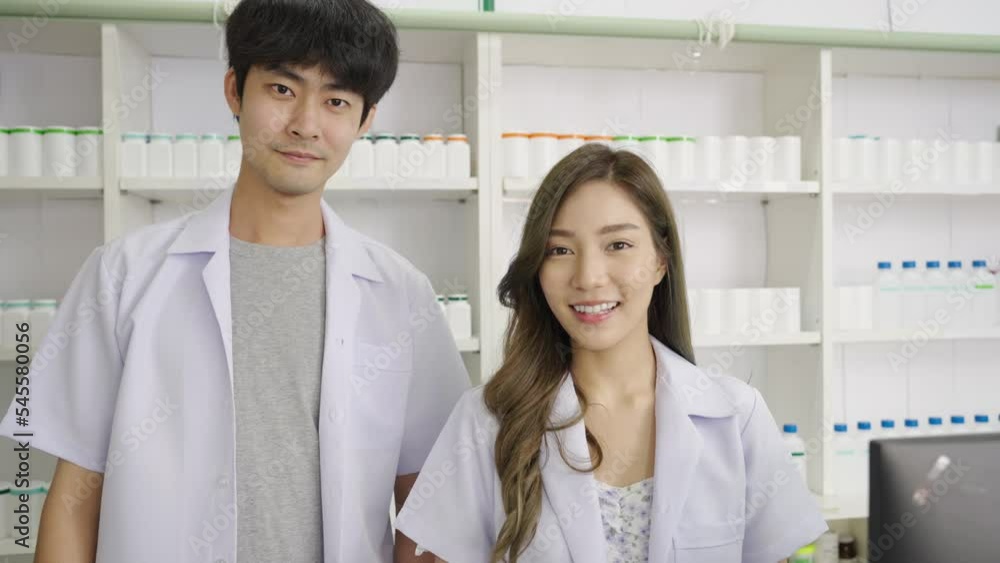 Portrait of smiling Asian pharmacist in drugstore or pharmacy, Looking at camera Portrait of smiling Asian pharmacist in drugstore or pharmacy, Looking at camera