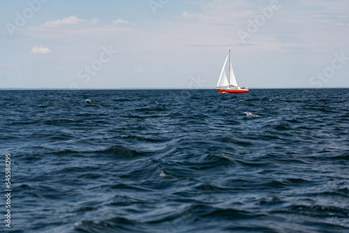 Sailing boat on blue open sea. Concept of Dream, adventure and freedom